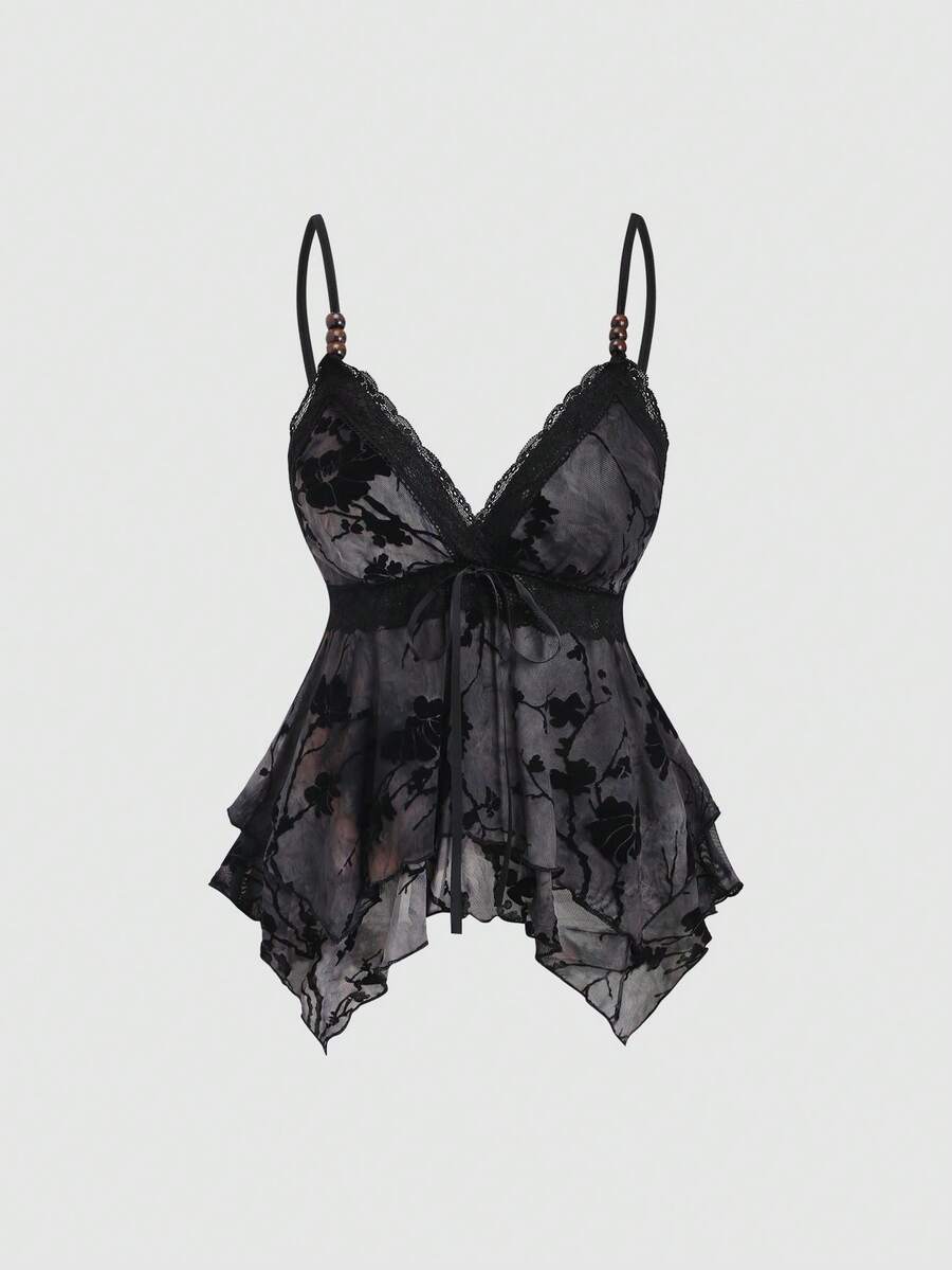 Women's black spaghetti strap tank top featuring contrast lace details, asymmetric ruffle hem, and slim fit design.