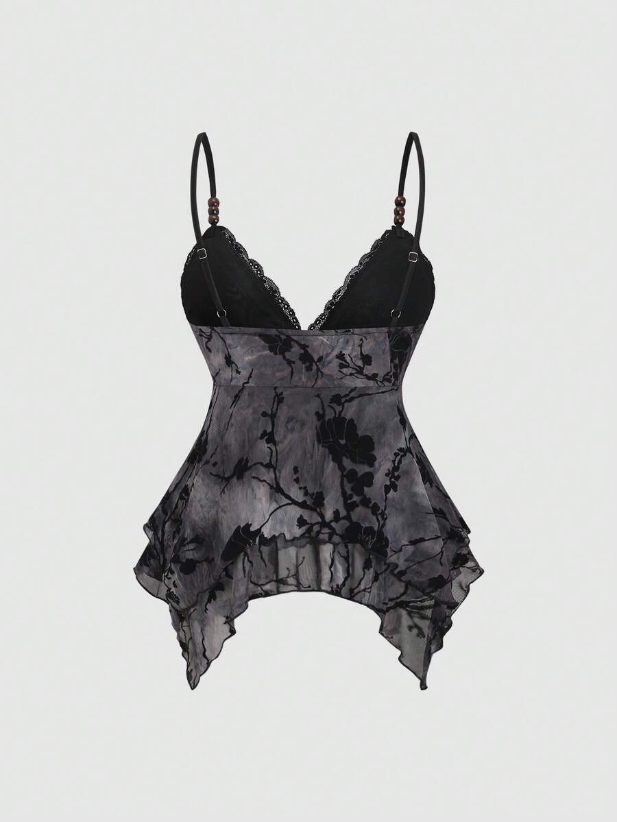 Women's black spaghetti strap tank top featuring contrast lace details, asymmetric ruffle hem, and slim fit design.