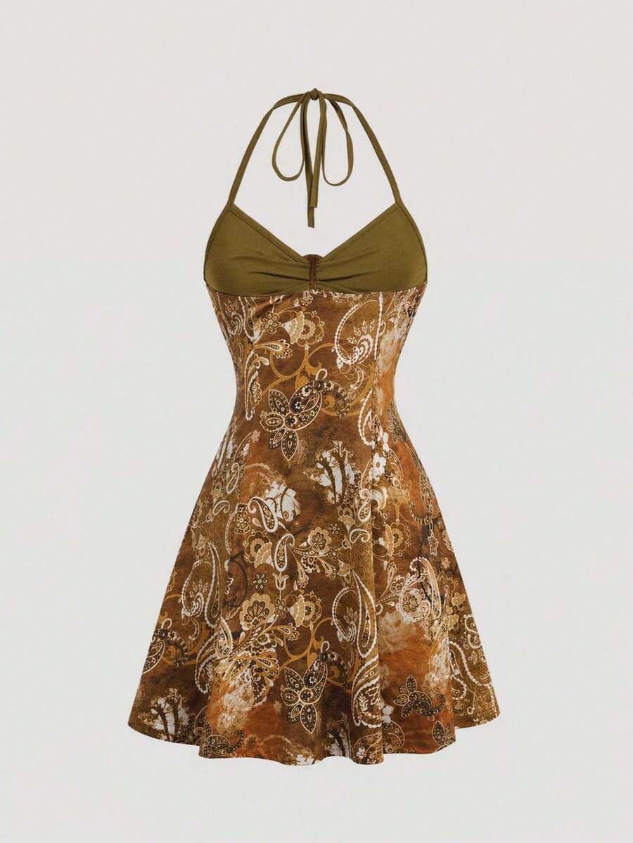 Women's apricot halter mini dress with backless knot and ring detail, sleeveless cami style, flared hem, and boho vacation look