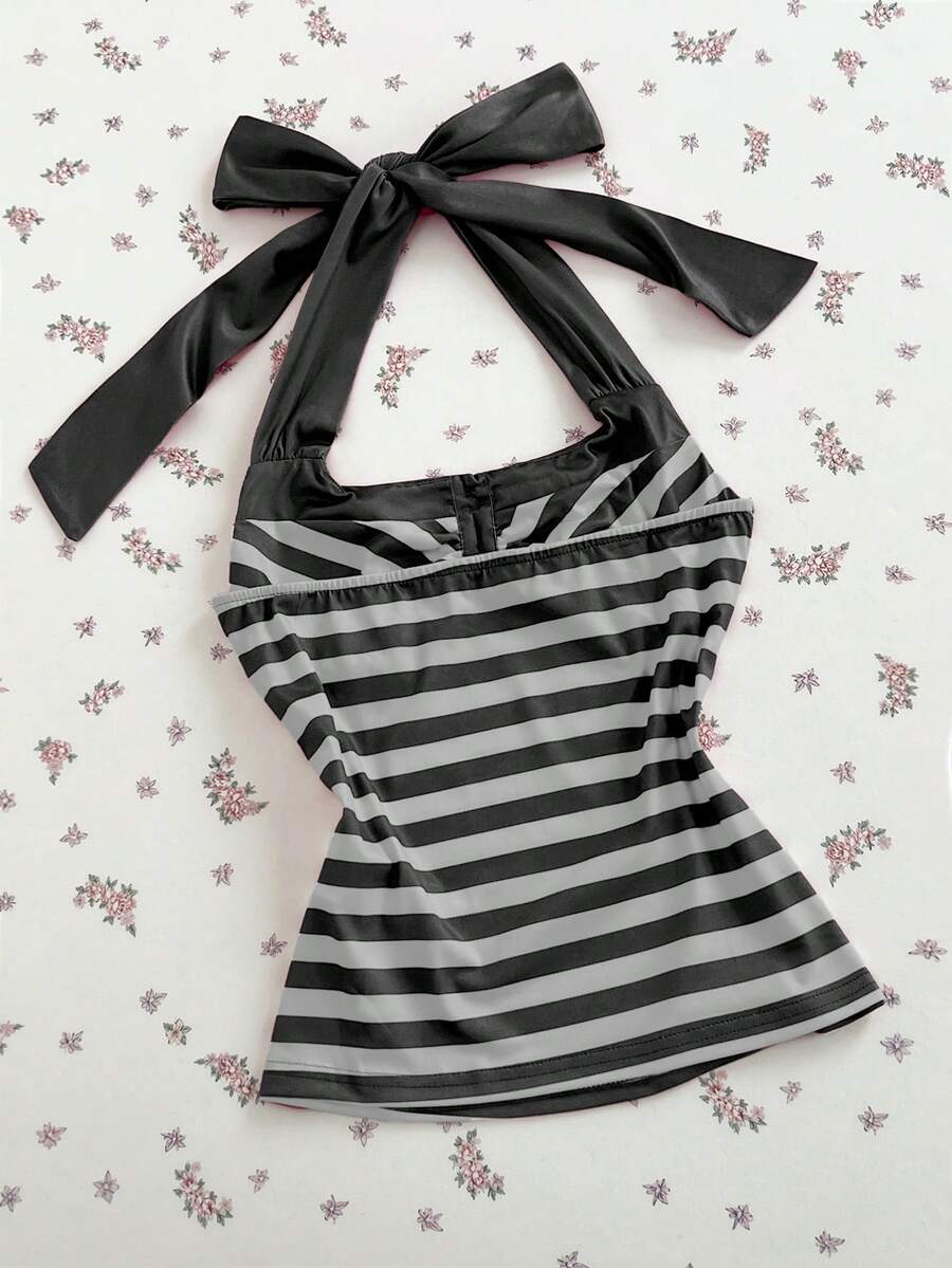 Women's multicolor striped halter top featuring a bow detail and slim fit design.