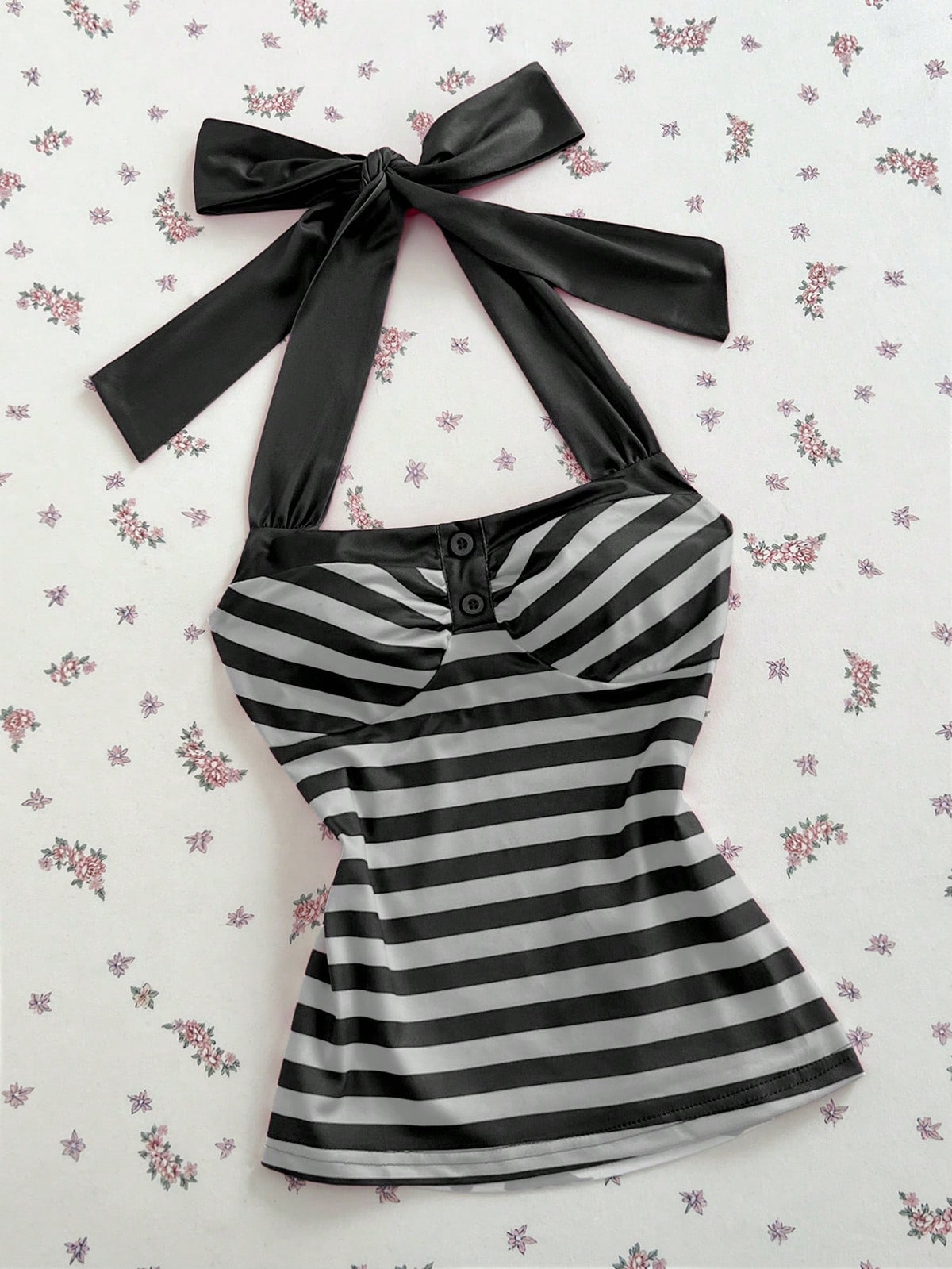 Women's multicolor striped halter top featuring a bow detail and slim fit design.