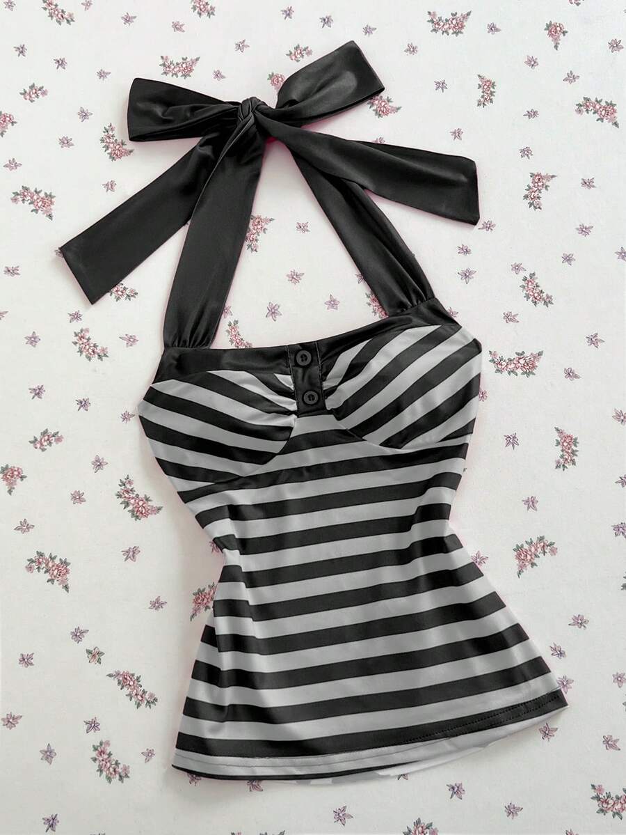 Women's multicolor striped halter top featuring a bow detail and slim fit design.