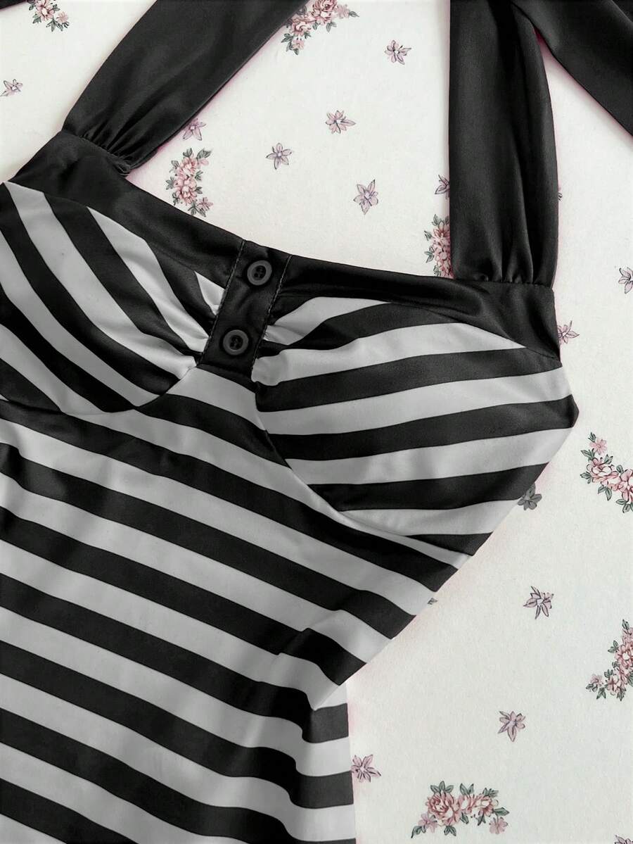 Women's multicolor striped halter top featuring a bow detail and slim fit design.