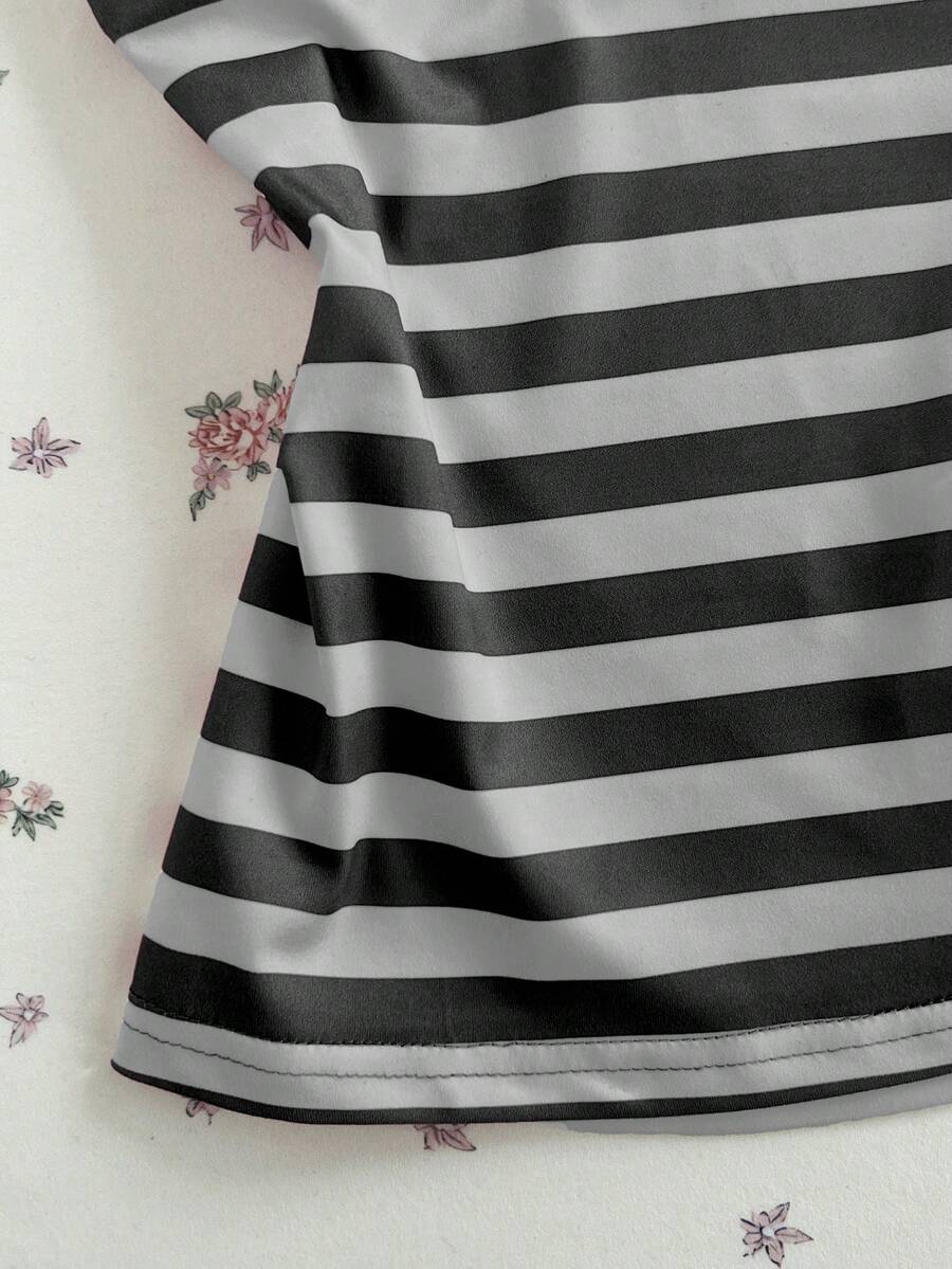 Women's multicolor striped halter top featuring a bow detail and slim fit design.