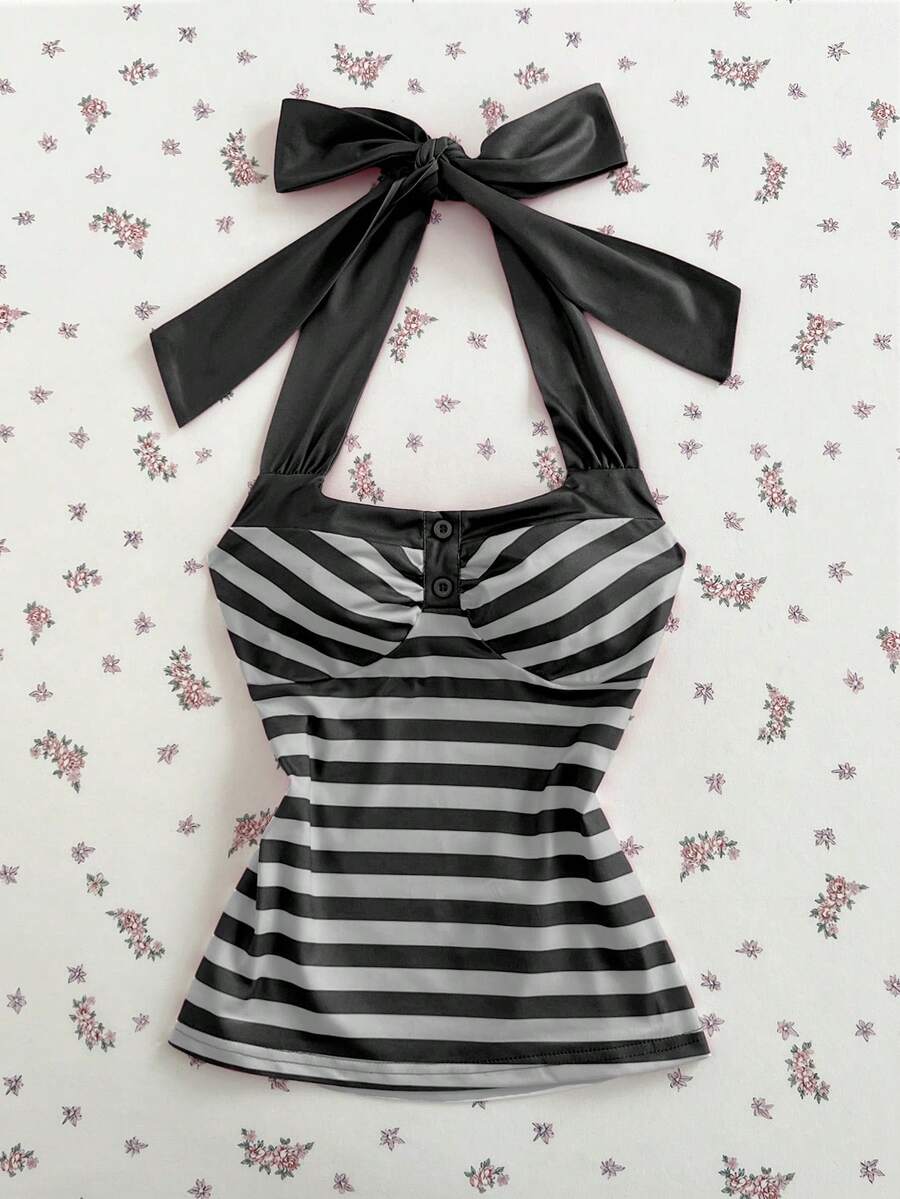 Women's multicolor striped halter top featuring a bow detail and slim fit design.
