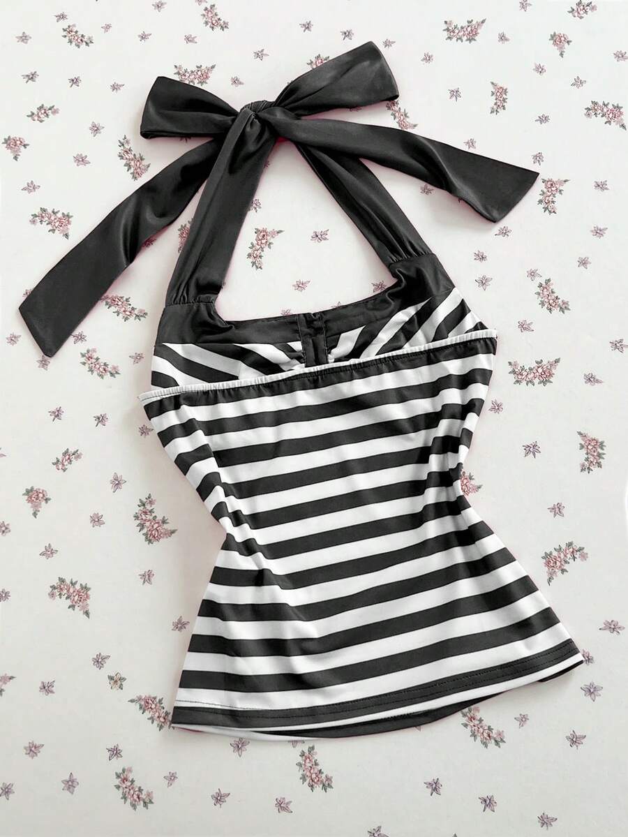 Women's multicolor striped halter top featuring a bow detail and slim fit design.