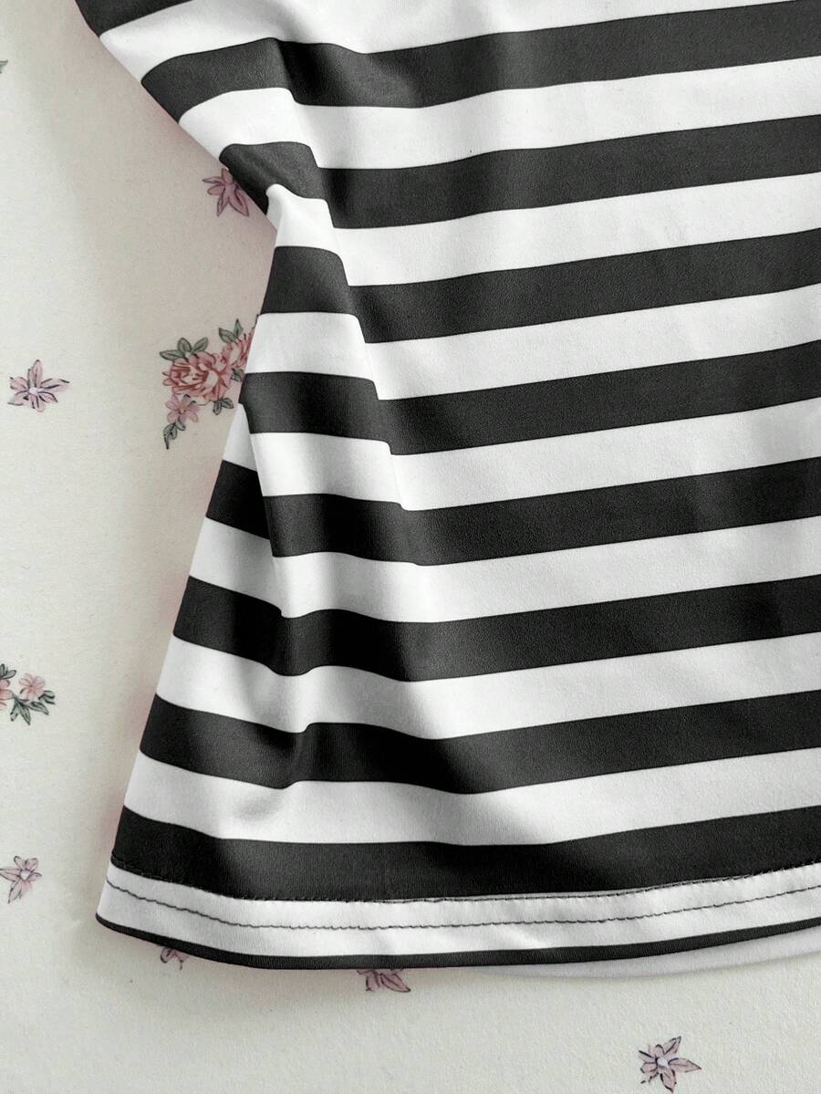 Women's multicolor striped halter top featuring a bow detail and slim fit design.