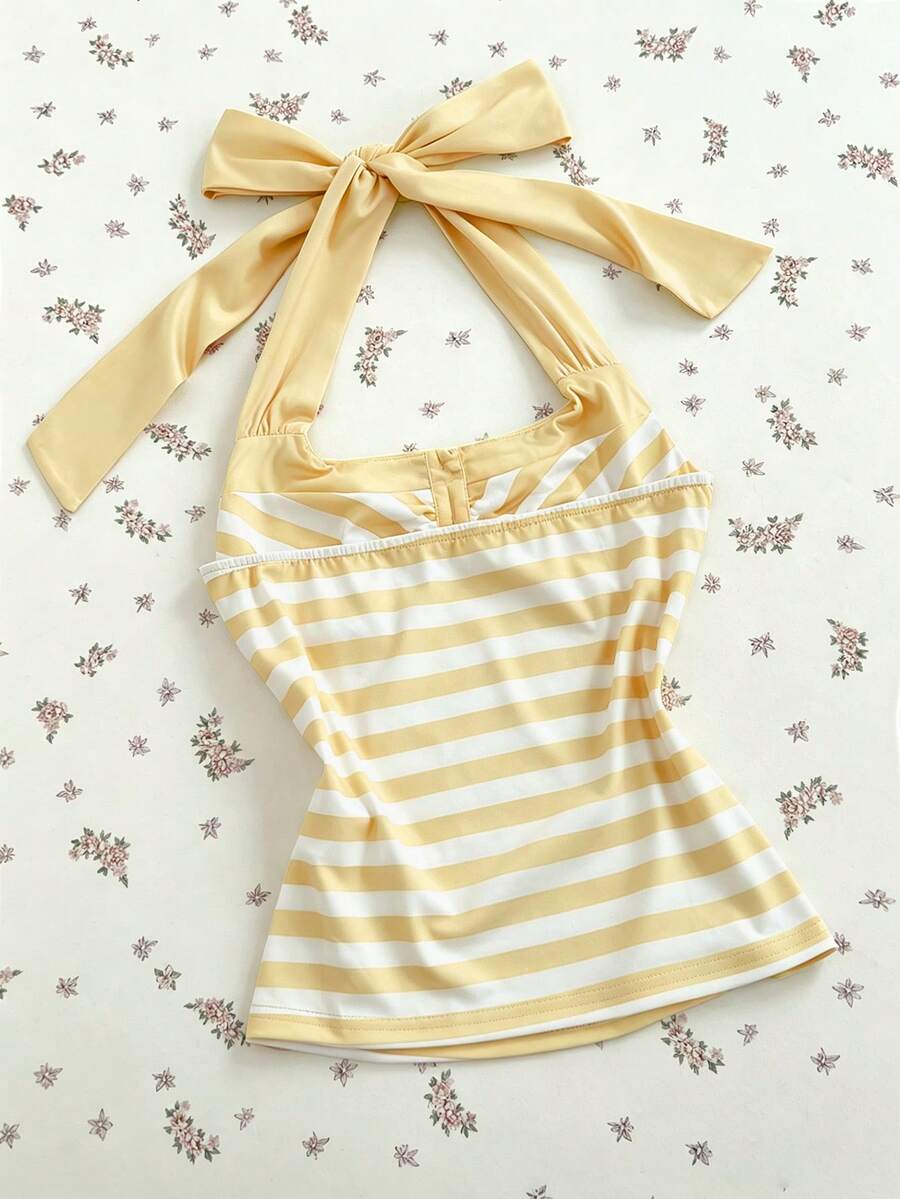 Women's multicolor striped halter top featuring a bow detail and slim fit design.