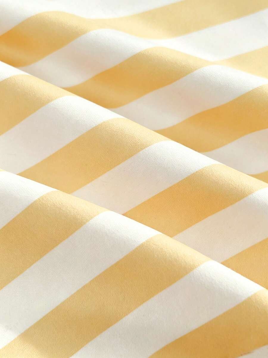 Women's multicolor striped halter top featuring a bow detail and slim fit design.