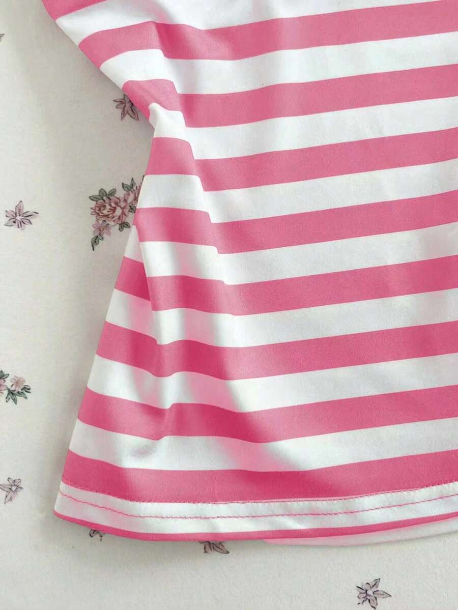 Women's multicolor striped halter top featuring a bow detail and slim fit design.