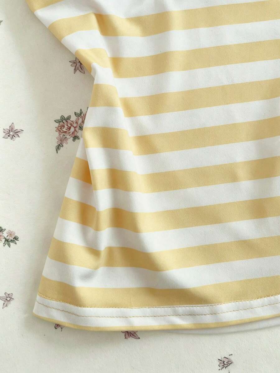 Women's multicolor striped halter top featuring a bow detail and slim fit design.