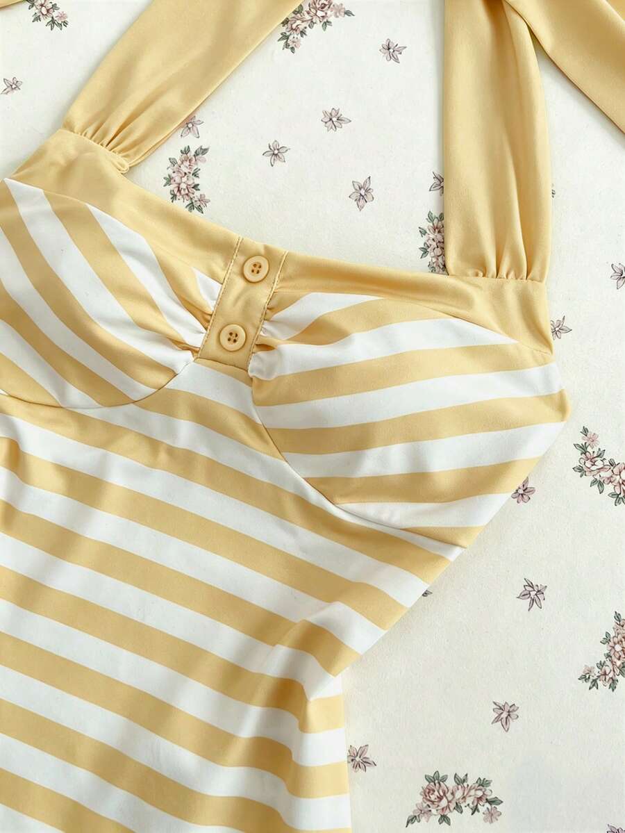 Women's multicolor striped halter top featuring a bow detail and slim fit design.
