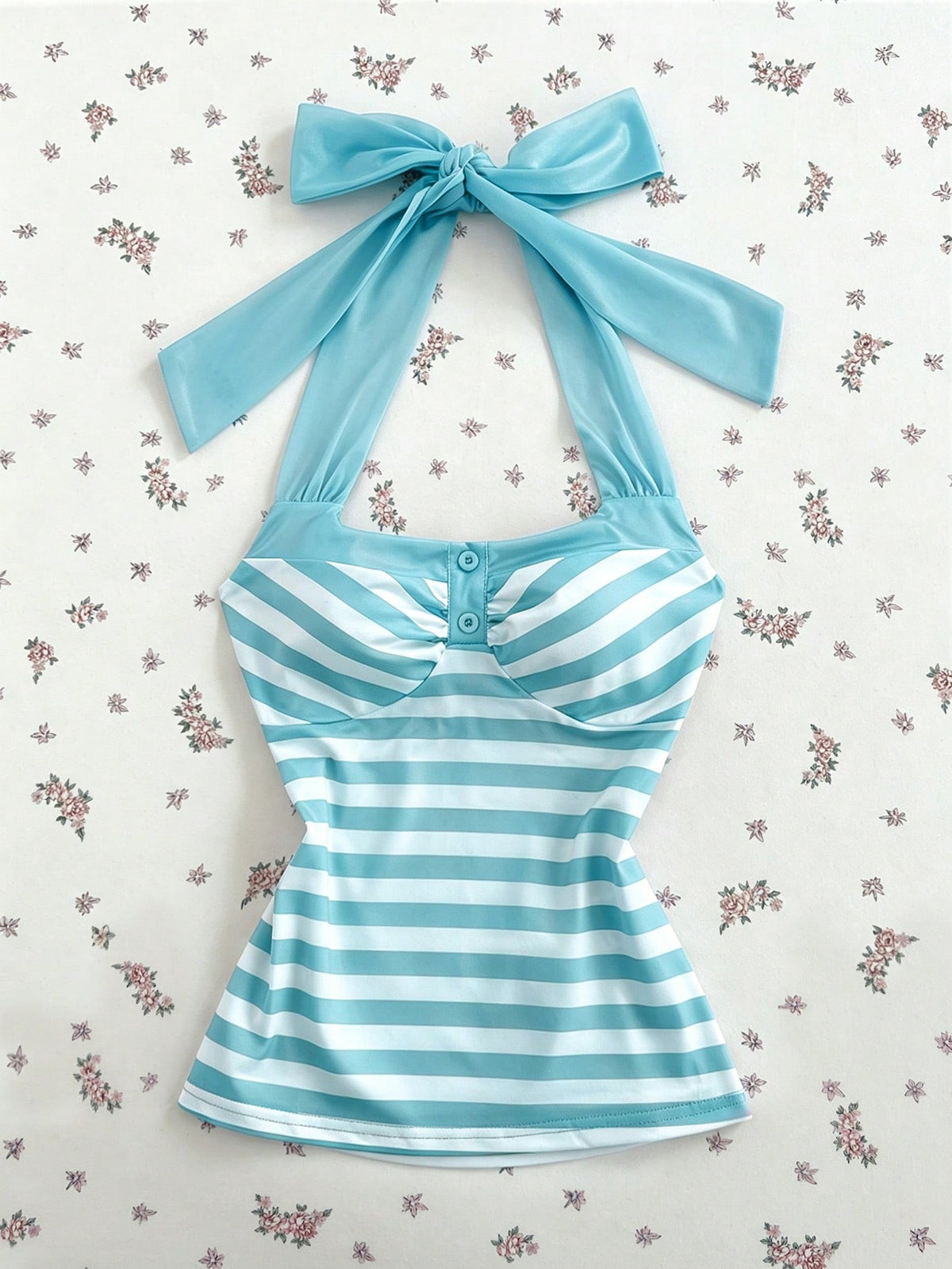 Women's multicolor striped halter top featuring a bow detail and slim fit design.