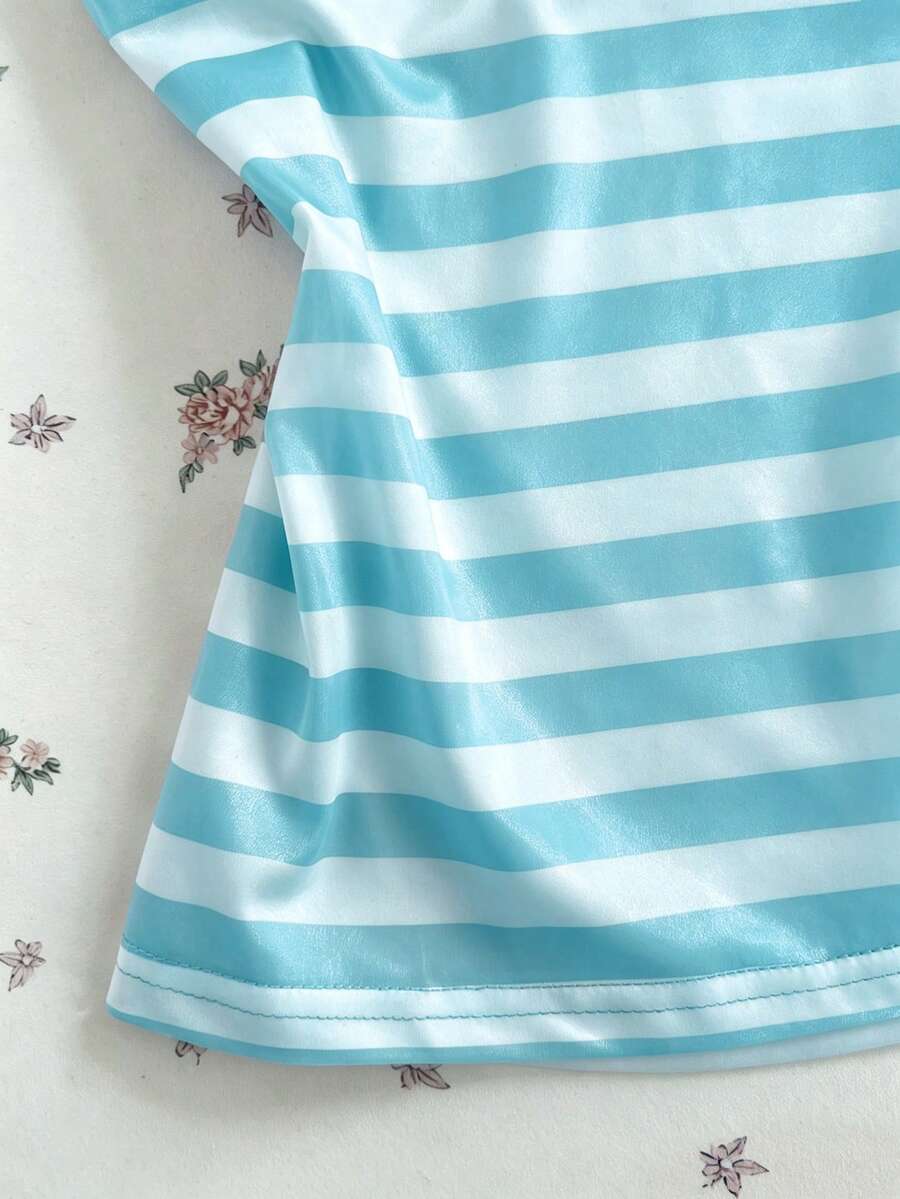 Women's multicolor striped halter top featuring a bow detail and slim fit design.