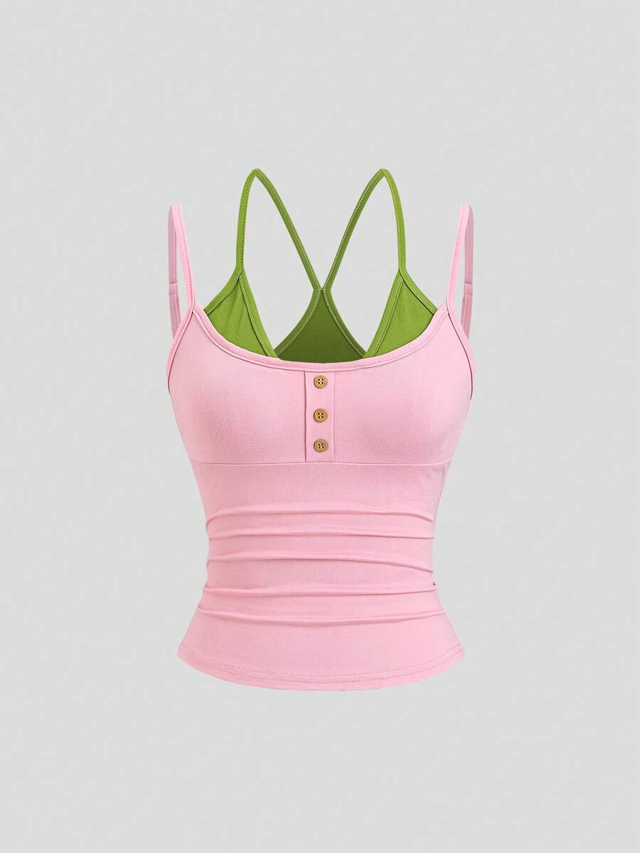 Women's pink colorblock cami tank top featuring spaghetti straps and criss-cross detailing in a slim fit knitted design.