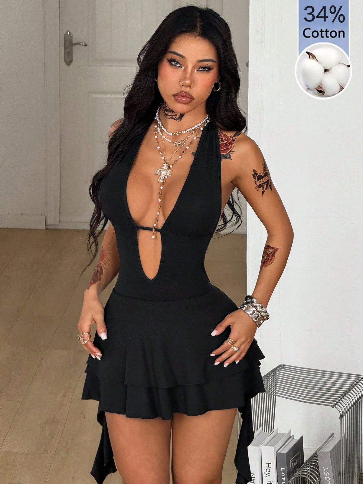 Women's sleeveless backless halter mini dress in coffee brown with a deep v-neckline, tie back detail, and a tiered A-line skirt.