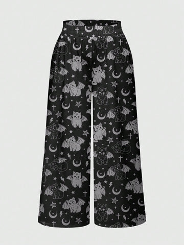 Women's plus size black gothic wide leg pants with split thigh detail and celestial moth, sun, and star pattern.