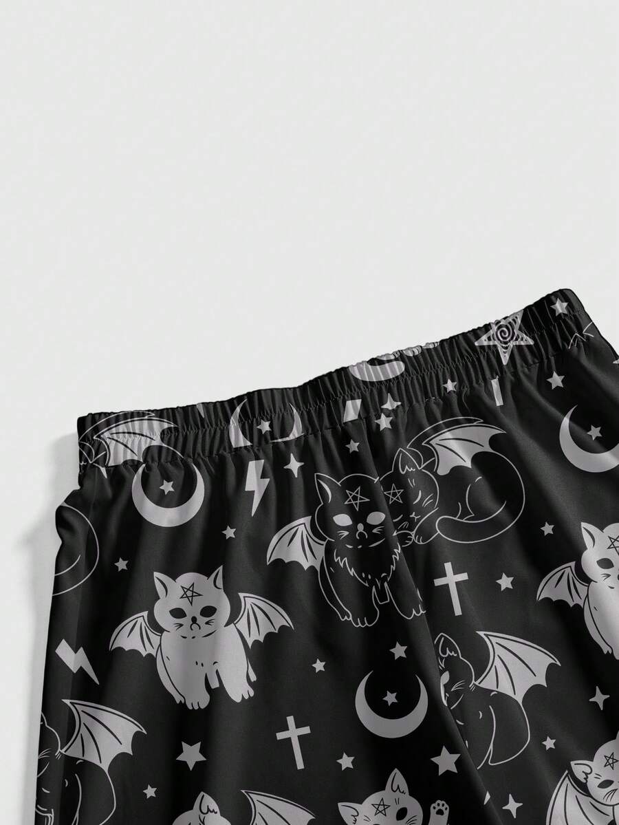 Women's plus size black gothic wide leg pants with split thigh detail and celestial moth, sun, and star pattern.