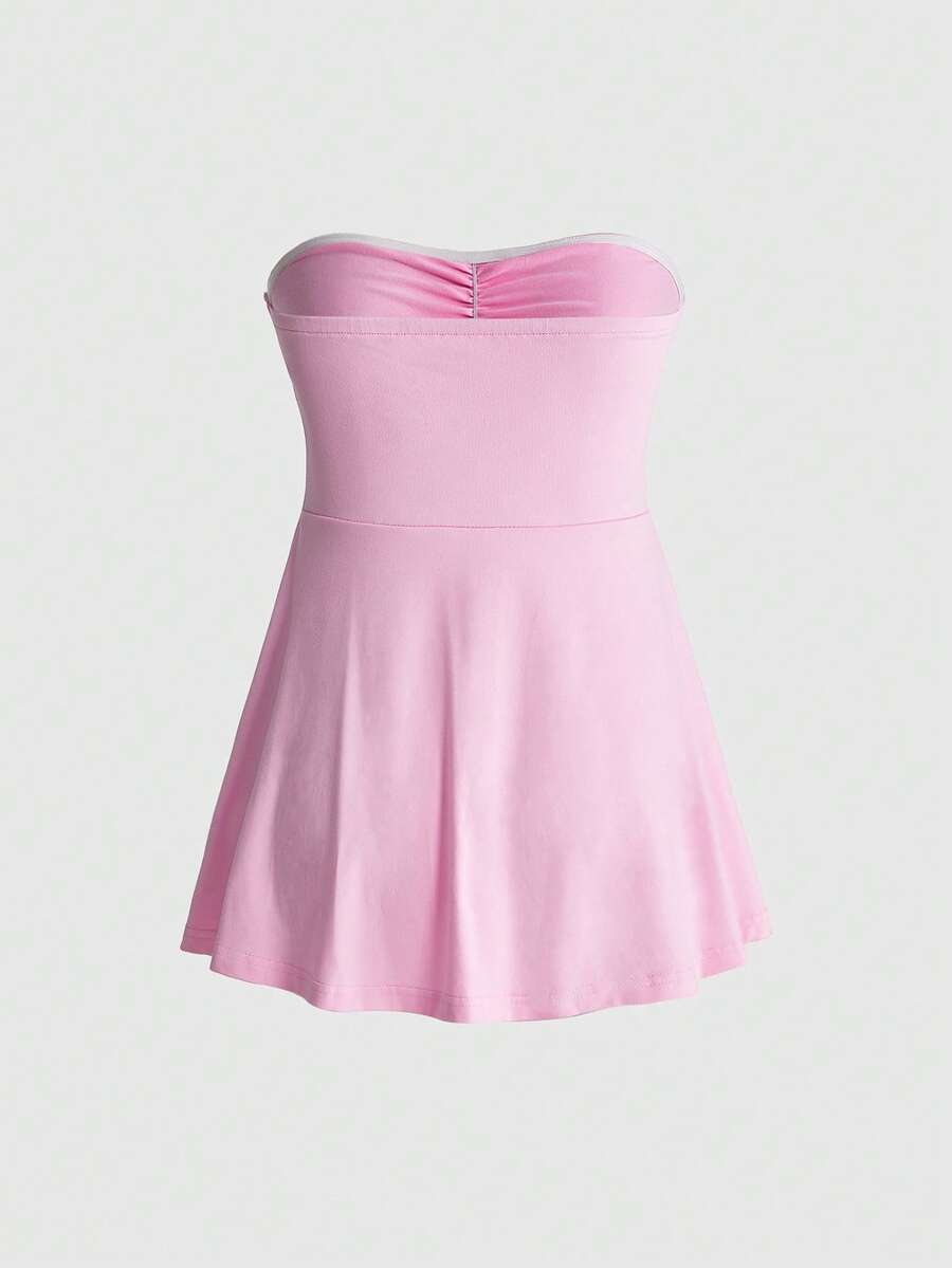 Women's striped strapless tube top featuring ruched detailing, flared hem, and stretchy knit fabric.