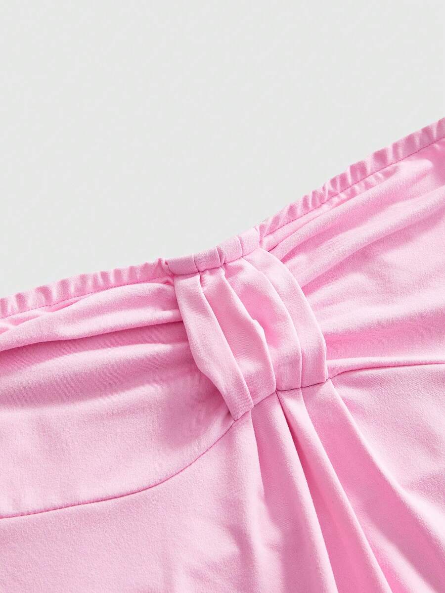 Women's striped strapless tube top featuring ruched detailing, flared hem, and stretchy knit fabric.