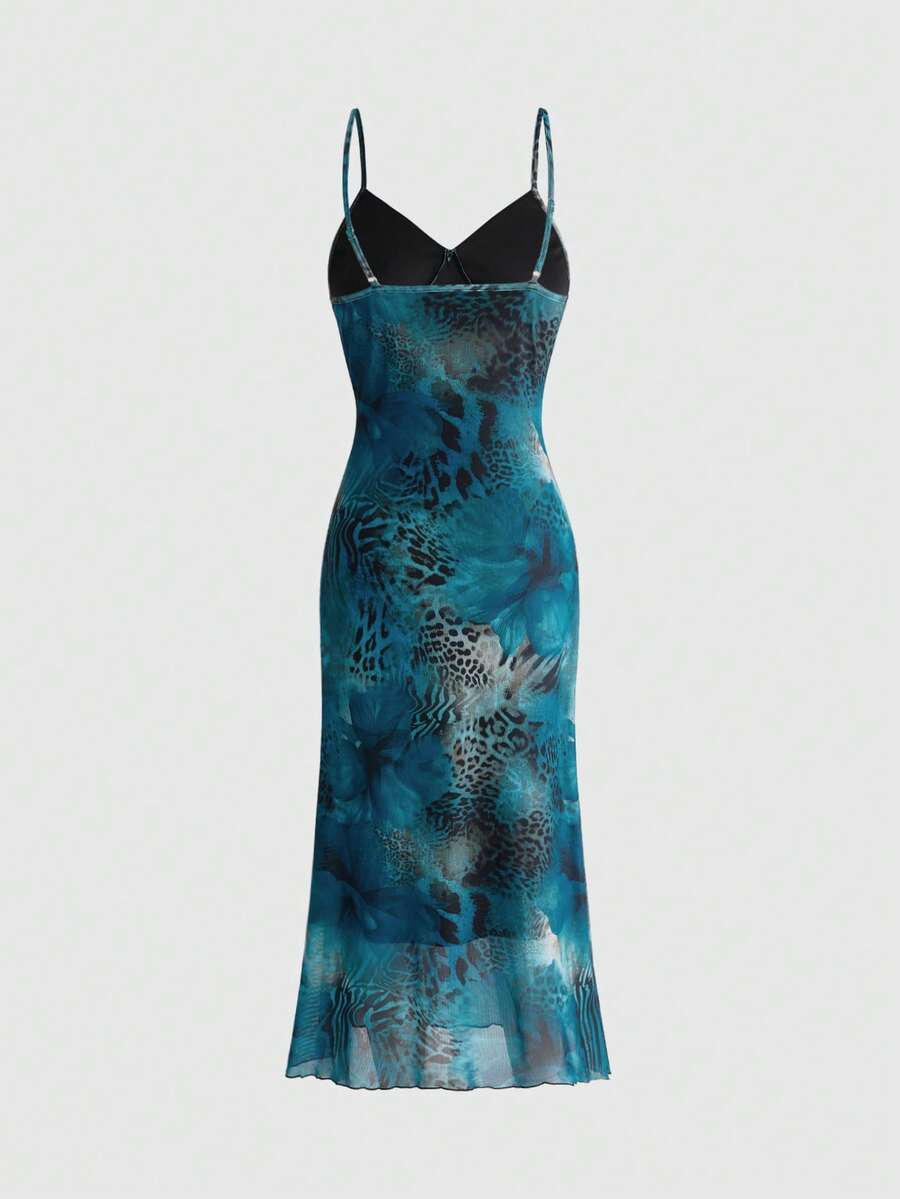 Women's sleeveless plaid cami maxi dress with spaghetti straps, backless detail, and a split thigh mermaid hem.