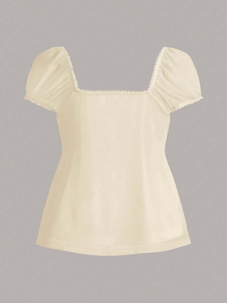Women's black short puff sleeve top featuring a square neckline, ruched bust detail, and flared ruffle hem.