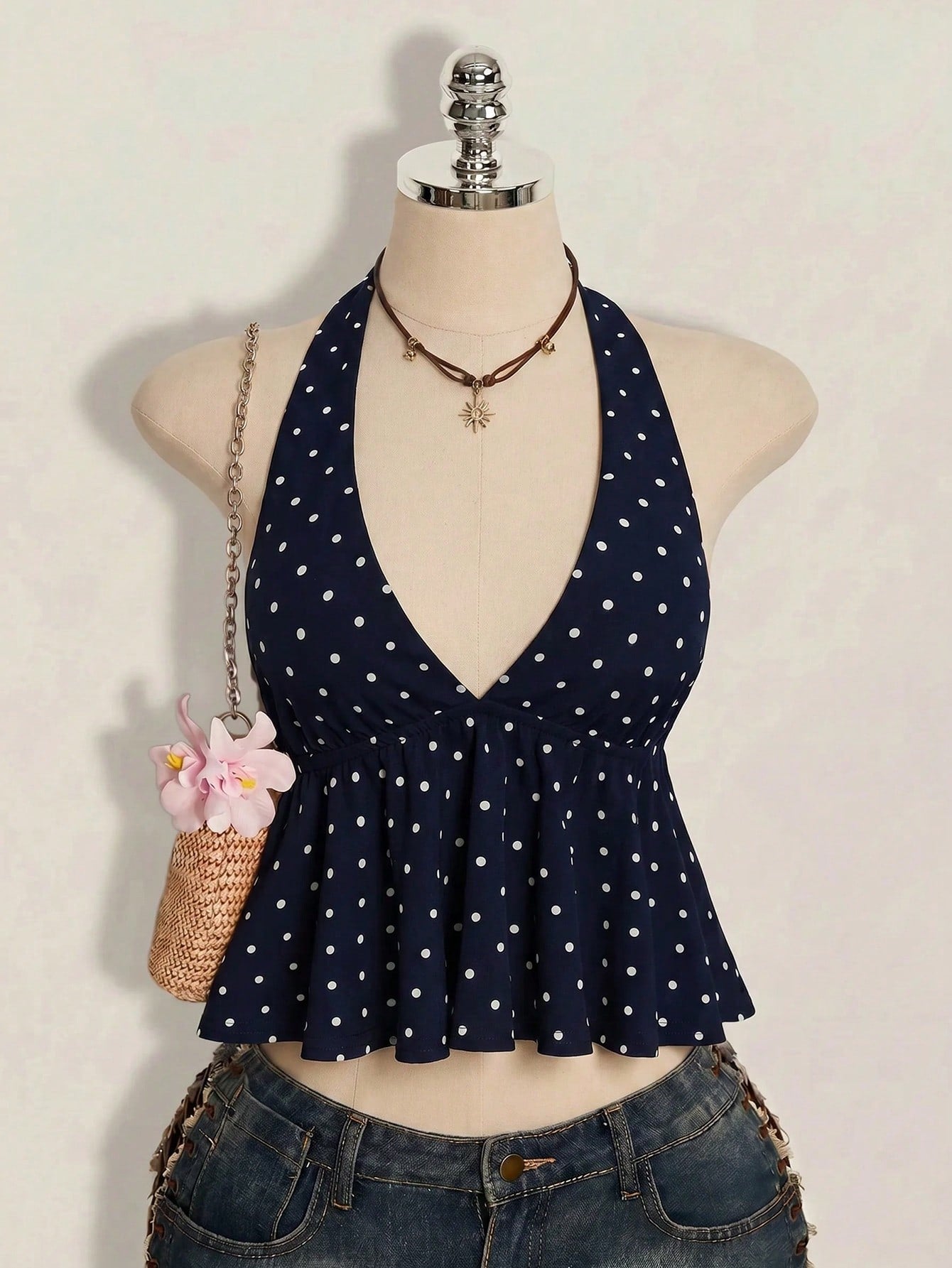Women's polka dot print halter camisole with backless knot detail, ruched front, slim fit, and flared ruffle hem