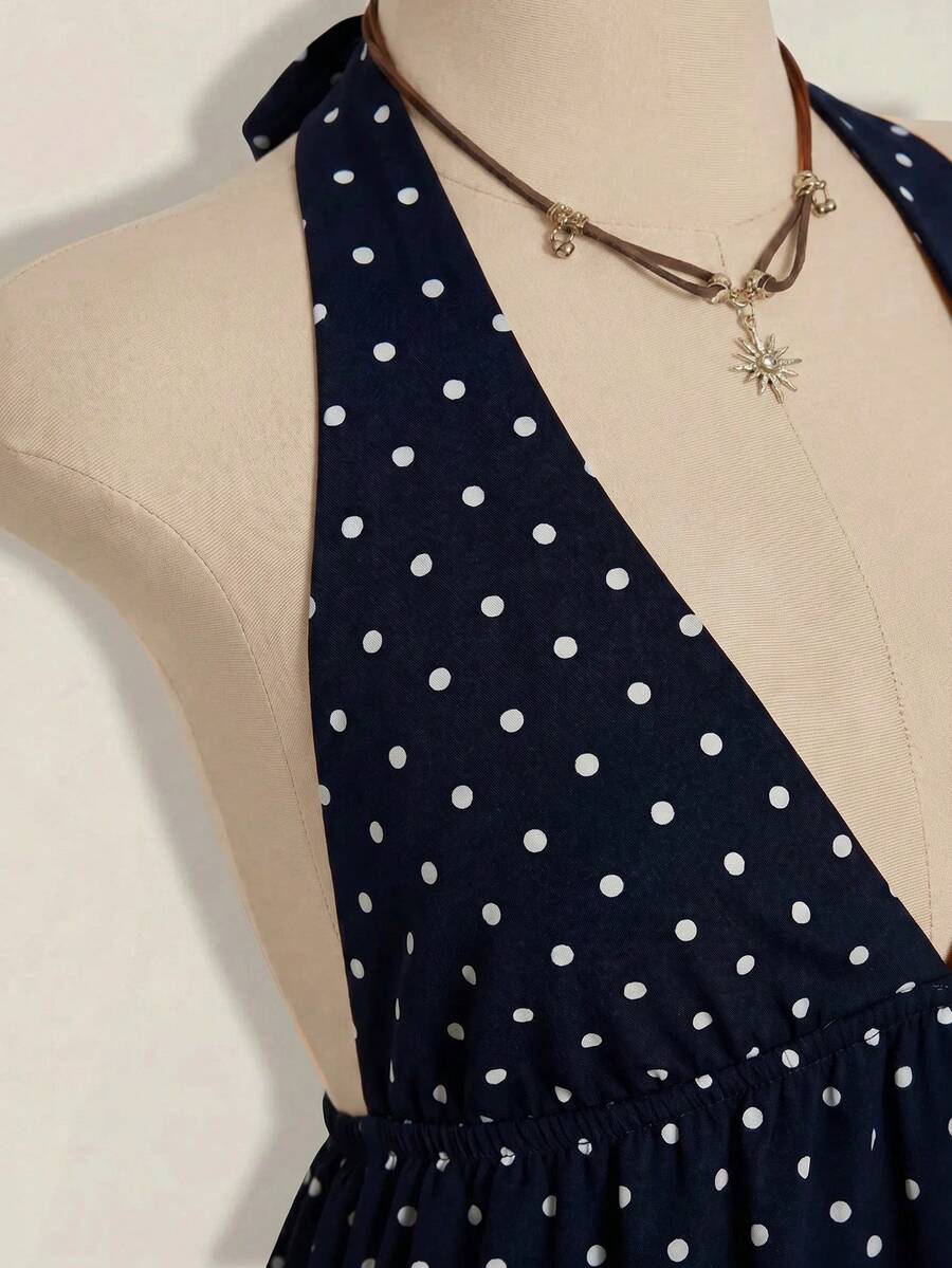 Women's polka dot print halter camisole with backless knot detail, ruched front, slim fit, and flared ruffle hem