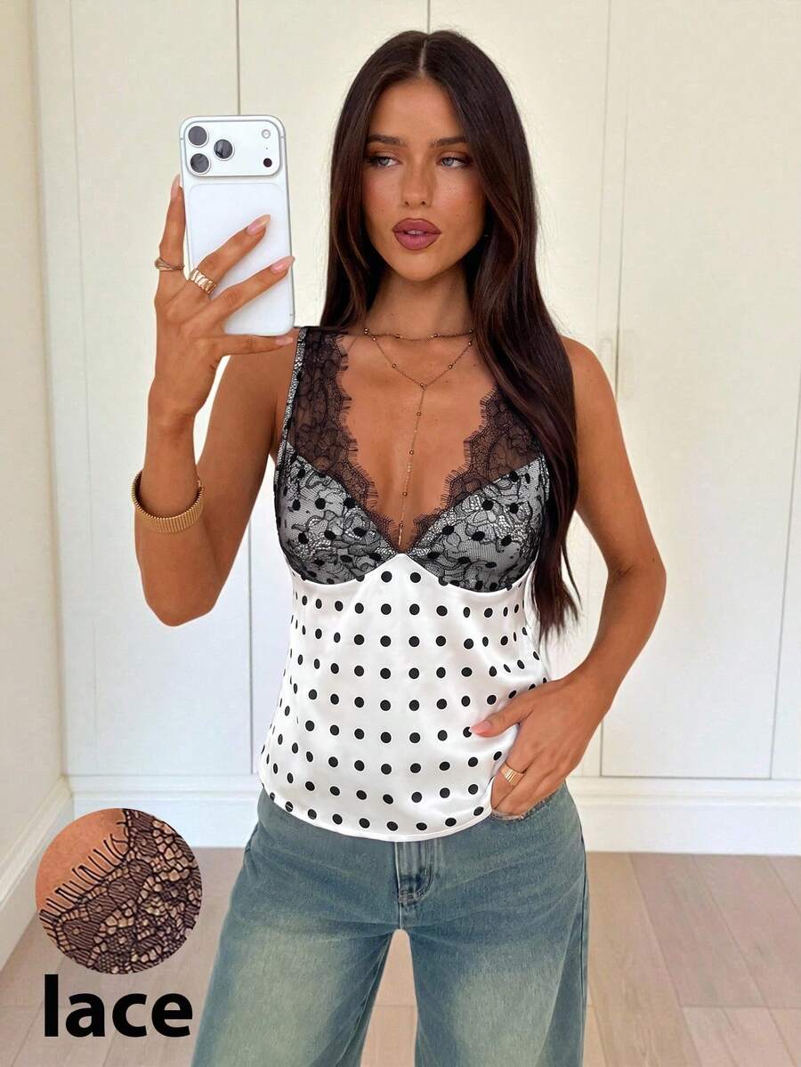 White vintage-style polka dot V-neck satin camisole top featuring contrast lace paneling, wide straps, and a flared hem.