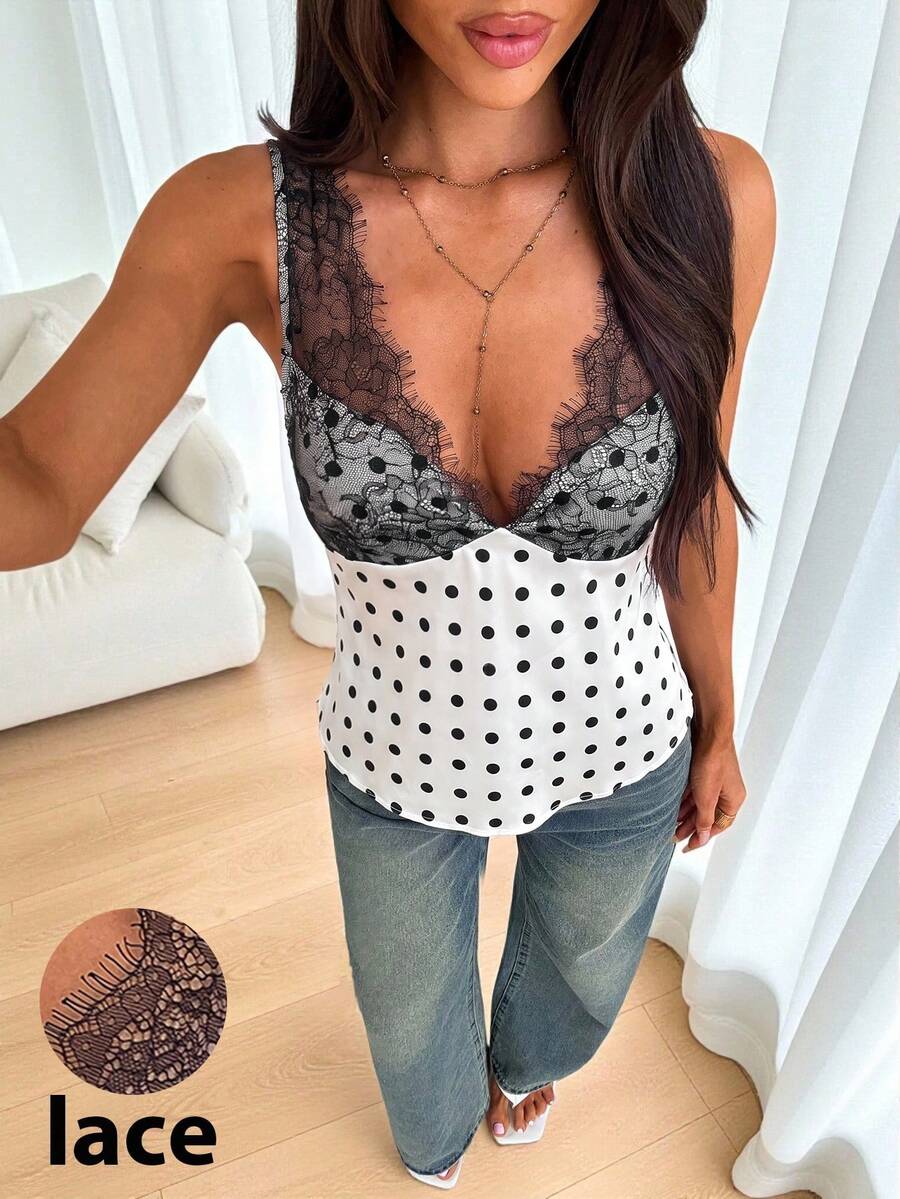 White vintage-style polka dot V-neck satin camisole top featuring contrast lace paneling, wide straps, and a flared hem.
