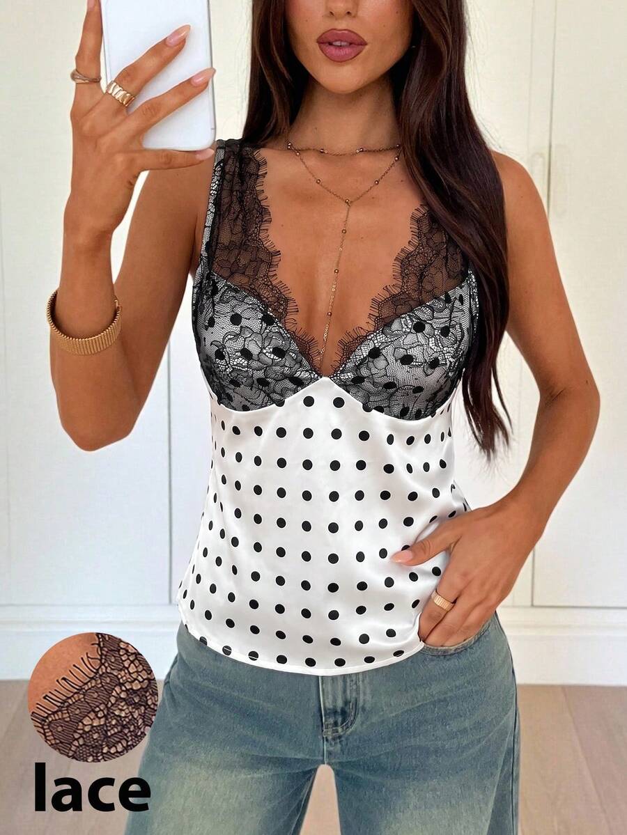 White vintage-style polka dot V-neck satin camisole top featuring contrast lace paneling, wide straps, and a flared hem.
