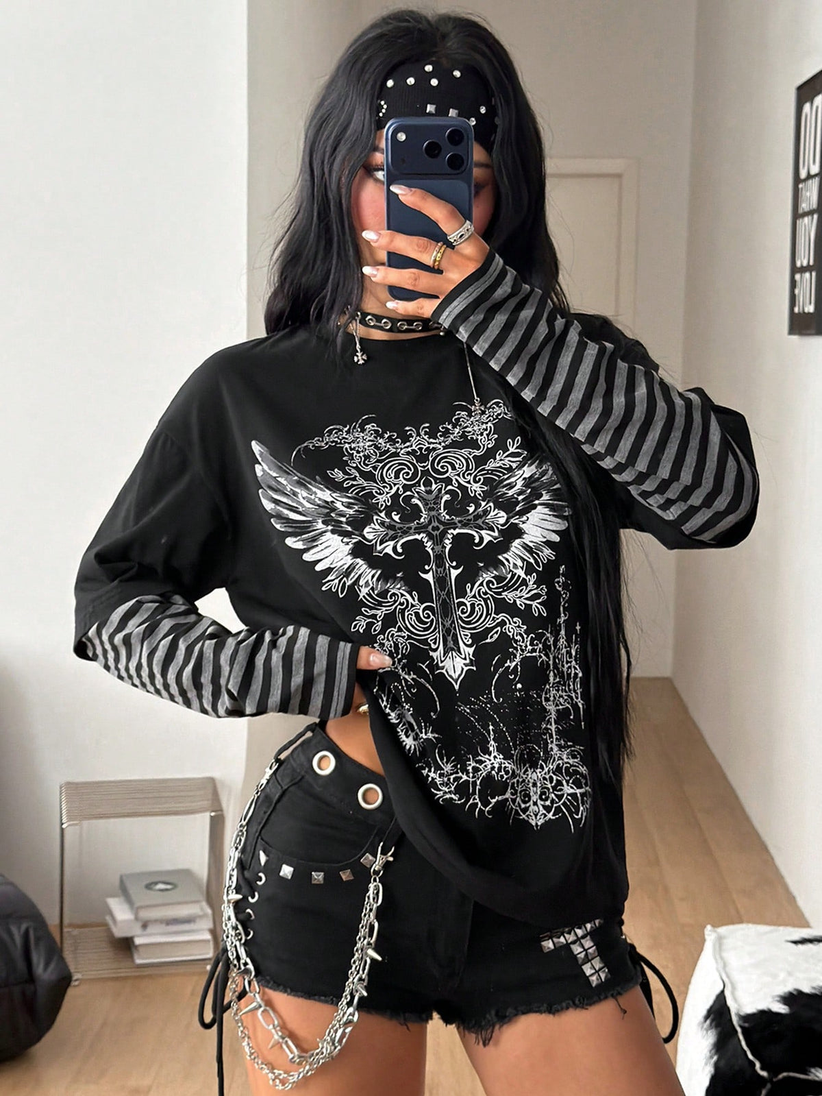 Women's casual graphic long sleeve t-shirt with a round neck, drop shoulder sleeves, and loose relaxed fit.