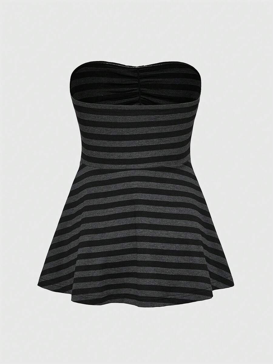 Women's striped strapless tube top featuring ruched detailing, flared hem, and stretchy knit fabric.