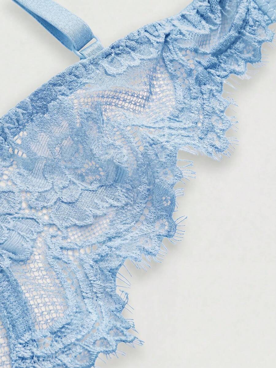 Sheer floral lace underwire triangle bra for women featuring adjustable straps and plunge cup design.