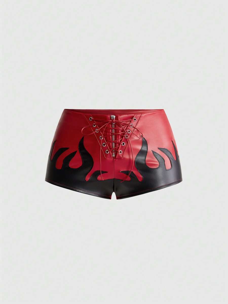 Punk ultra low waist skinny PU mini shorts with flame embroidery, rhinestone details, zipper fly closure, and a graphic Halloween-inspired festival style.