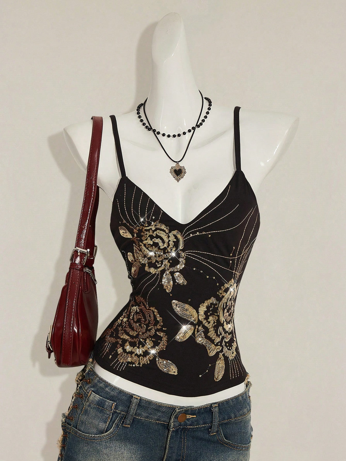 Women's floral embroidered sequin camisole top with thin spaghetti straps and a slim fit design.