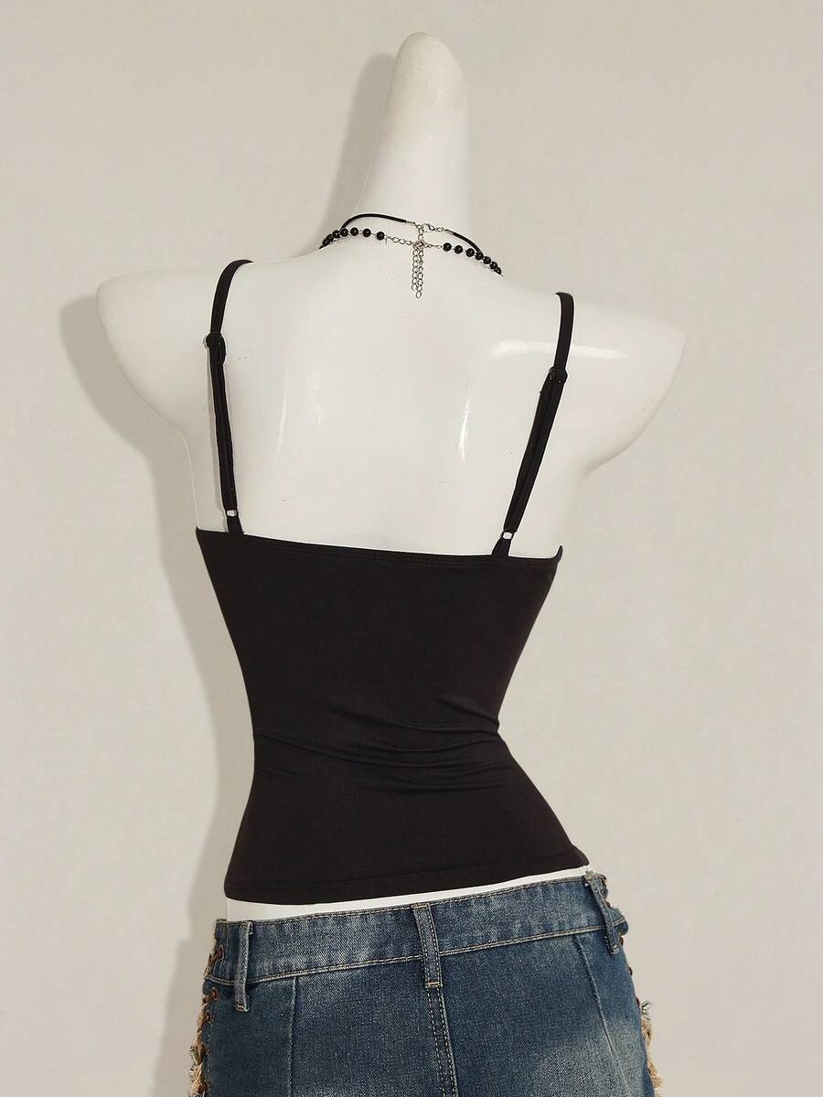 Women's floral embroidered sequin camisole top with thin spaghetti straps and a slim fit design.