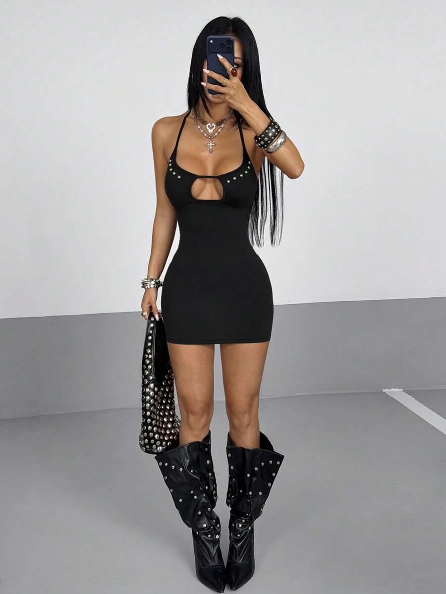 Women's black knitted mini dress with studded details, cutout halter neckline, tie-up design, sleeveless cami style, and slim fit pencil shape
