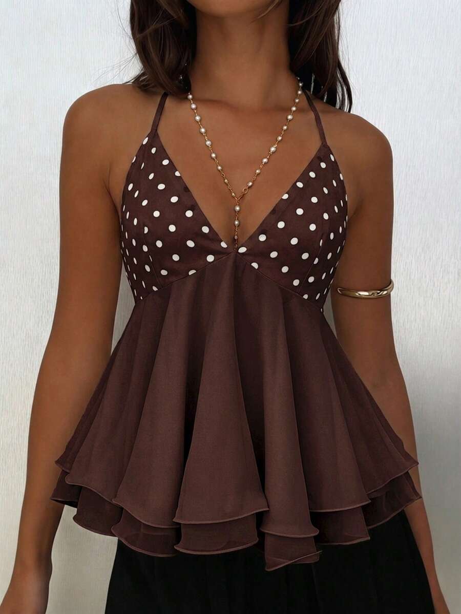 Women's apricot halter cami top with twist detail, studded accents, slim fit, regular length, and flared hem in woven fabric.