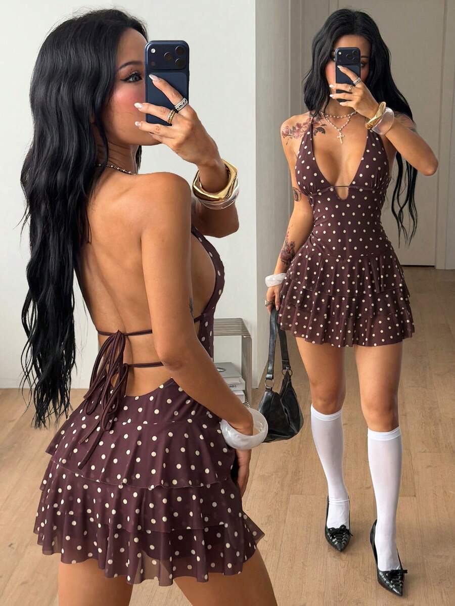 Front view of a women's lace halter mini dress featuring a slim-fit bodice, flared hem, and sleeveless design.