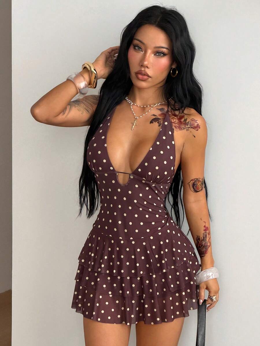 Front view of a women's lace halter mini dress featuring a slim-fit bodice, flared hem, and sleeveless design.