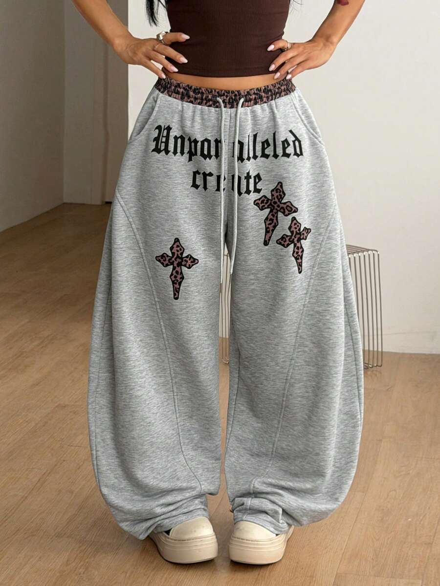 Women's casual grey plaid sweatpants featuring an elastic drawstring waistband, side pockets, and a relaxed loose fit.