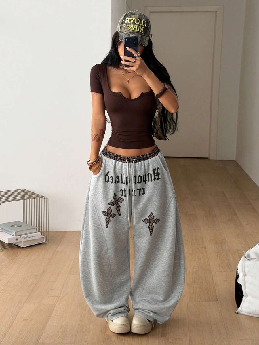Women's casual grey plaid sweatpants featuring an elastic drawstring waistband, side pockets, and a relaxed loose fit.