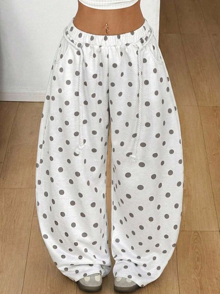 Women's casual grey plaid sweatpants featuring an elastic drawstring waistband, side pockets, and a relaxed loose fit.