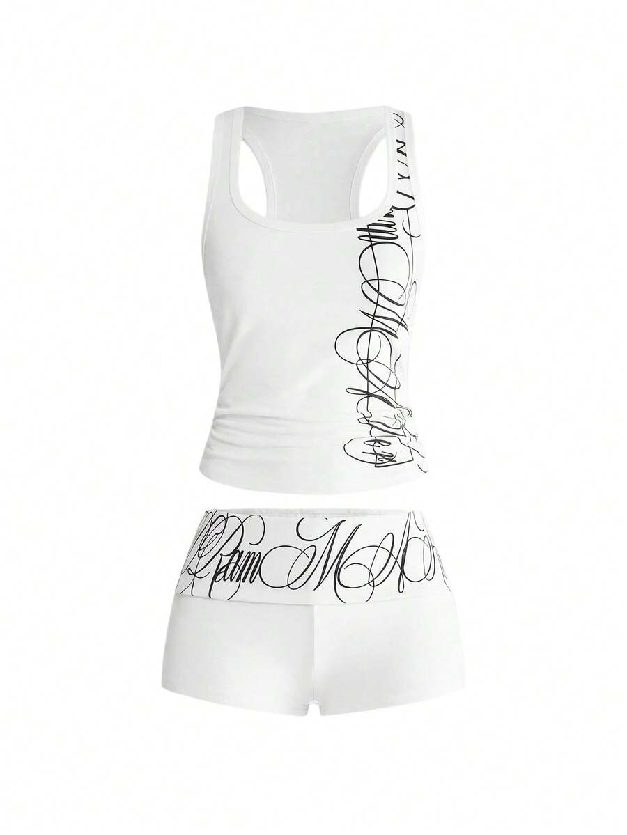 Punk-inspired two-piece set with a fitted scoop neck slogan tank top featuring cross and rhinestone details paired with ultra low waist mini shorts.