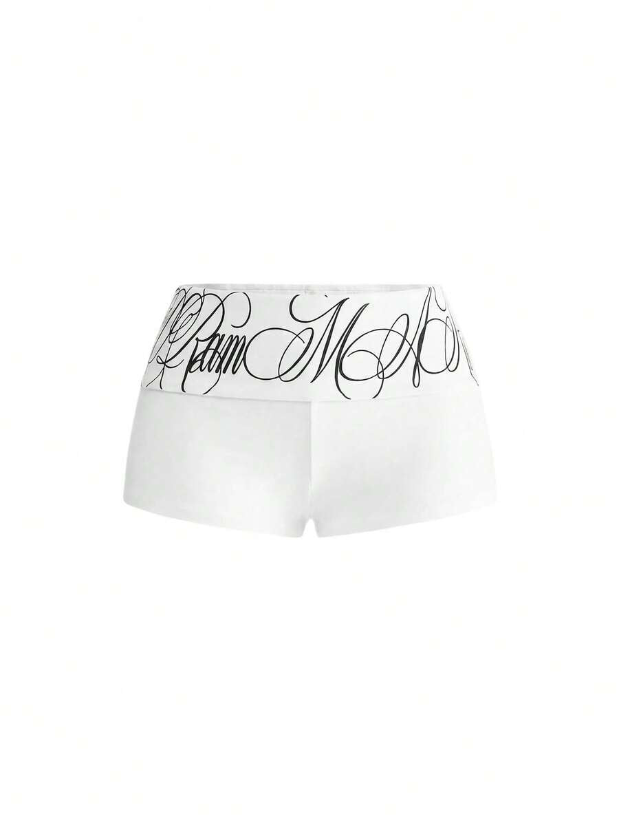 Punk-inspired two-piece set with a fitted scoop neck slogan tank top featuring cross and rhinestone details paired with ultra low waist mini shorts.