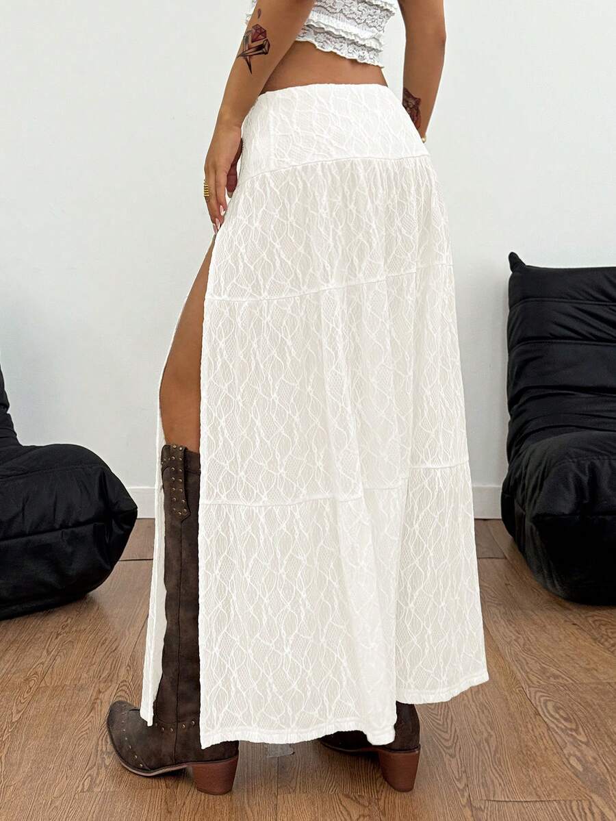 Women's red plaid long skirt featuring a low-rise waist and a side slit in lightweight woven fabric.