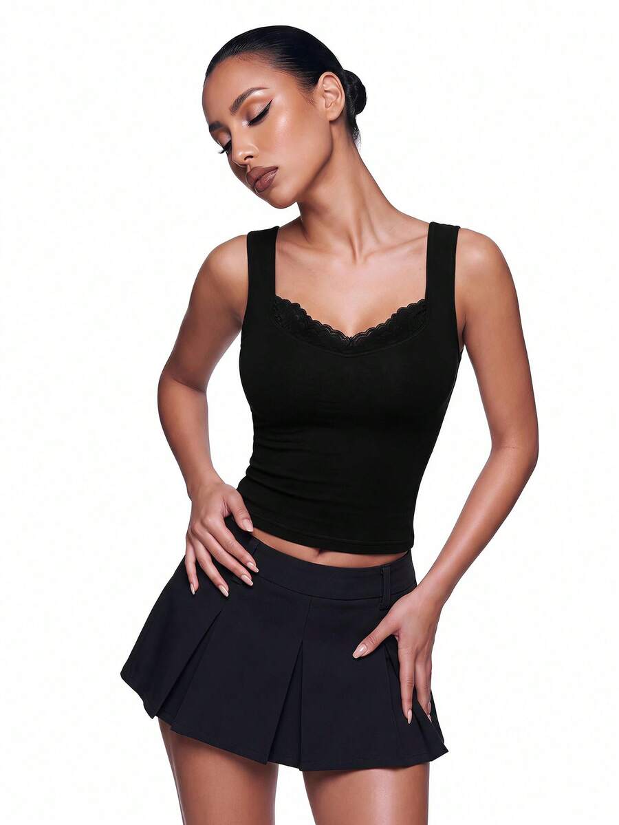 Black sleeveless crop cami top with wide straps, contrast lace trim, rib-knit texture, slim fit, and regular hem