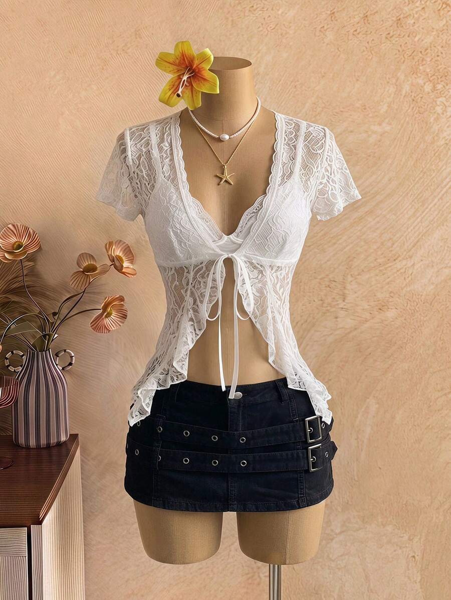 Women's semi-sheer deep V-neck top featuring cap sleeves, contrast lace trimming, and a lace-up front detail.
