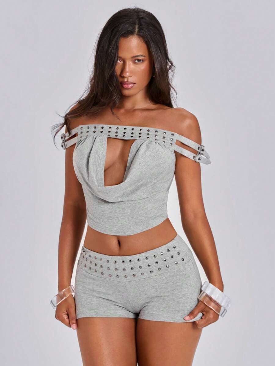 Women's grey Y2K two-piece set featuring an off-the-shoulder crop top with studded details and matching mini shorts.
